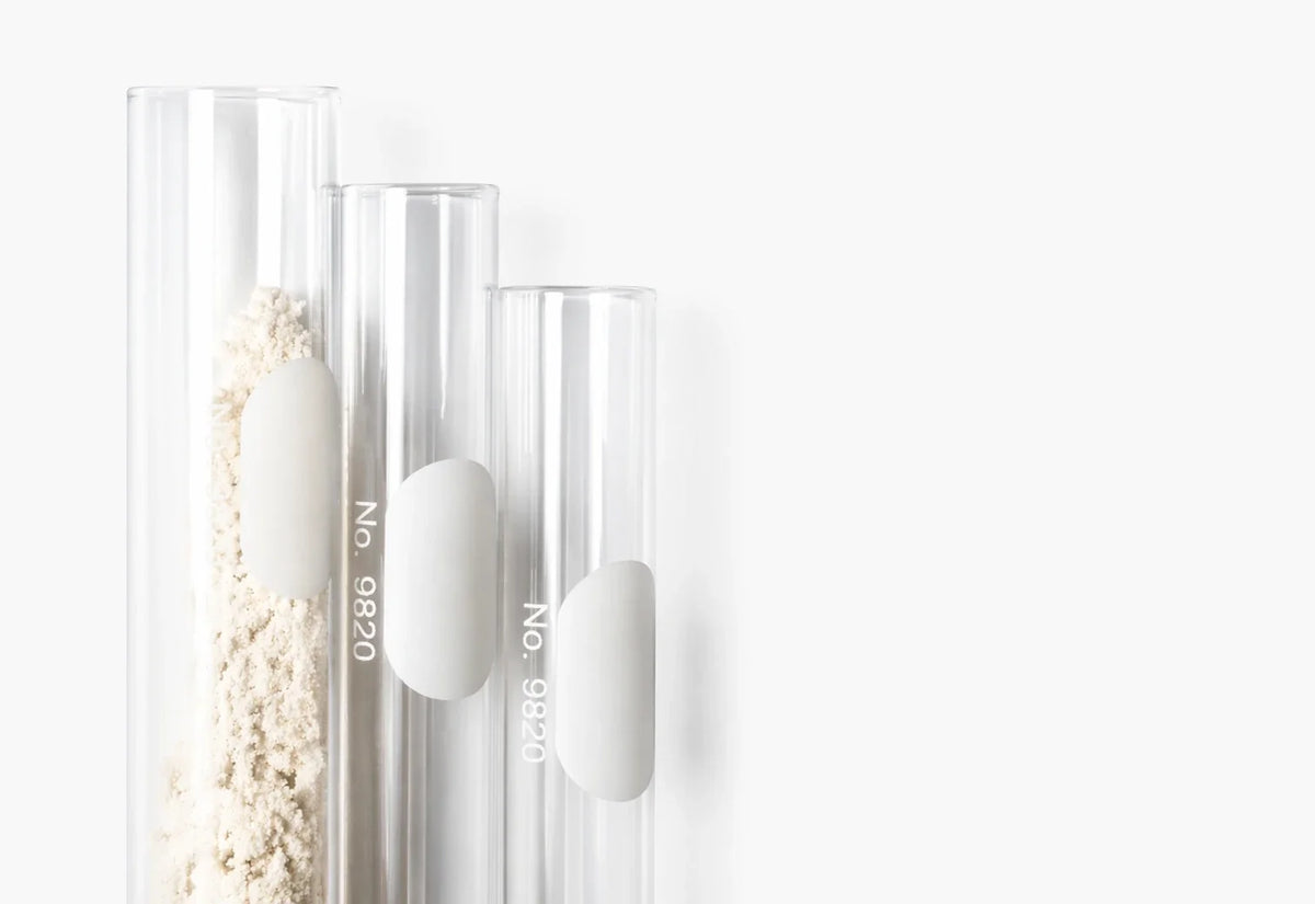 Glass tubes, one filled with protein powder